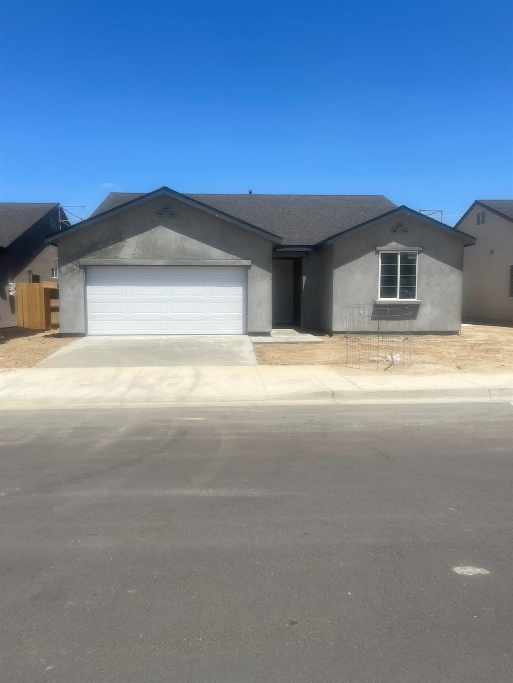 13416 Fourth St Unit Lot9, Parlier, CA 93648 - ranch-style house with an attached garage, stucco siding, and driveway