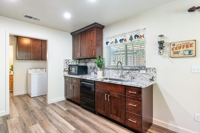 39398 Robin, Bass Lake, CA 93604 - kitchen featuring washer / clothes dryer, black appliances, a sink, light wood-type flooring, and light stone counters