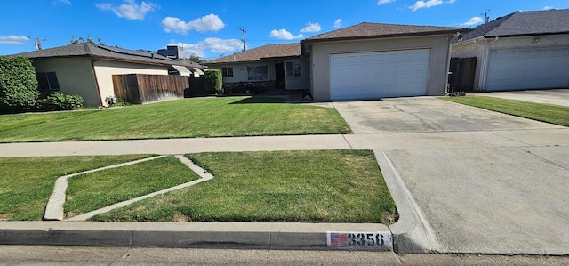 3356 E Austin Way, Fresno, CA 93726 - ranch-style home featuring stucco siding, an attached garage, and driveway