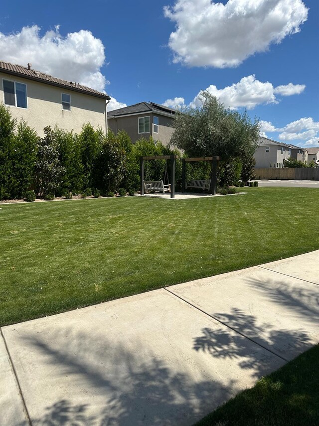 663 Farmhouse Ln, Clovis, CA 93619 - view of green lawn featuring a pergola and a patio area