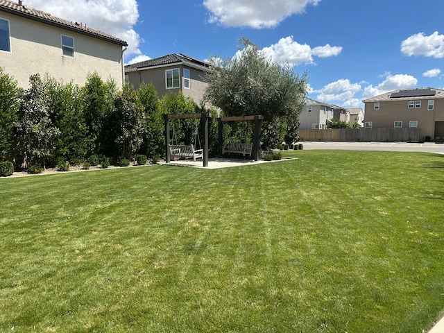 663 Farmhouse Ln, Clovis, CA 93619 - view of grassy yard with a pergola and a residential view