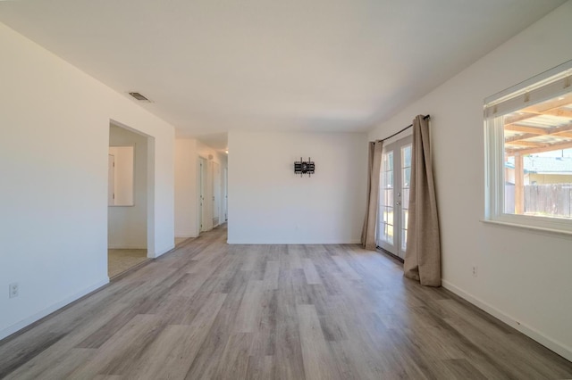 1380 Elaine Dr, Hanford, CA 93230 - spare room with light wood-type flooring and french doors