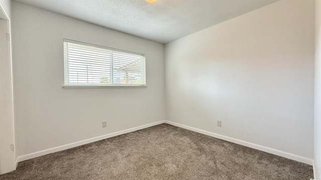 1380 Elaine Dr, Hanford, CA 93230 - carpeted spare room featuring baseboards and a textured ceiling