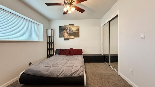 1380 Elaine Dr, Hanford, CA 93230 - carpeted bedroom with a closet, ceiling fan, and baseboards