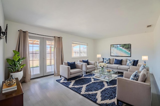 1380 Elaine Dr, Hanford, CA 93230 - living area featuring french doors and wood finished floors