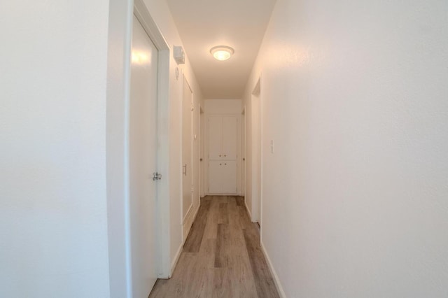 1380 Elaine Dr, Hanford, CA 93230 - corridor with light wood-style flooring and baseboards