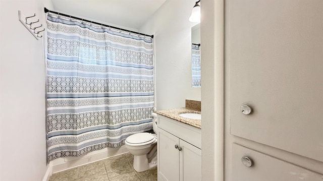 1380 Elaine Dr, Hanford, CA 93230 - full bath with vanity, toilet, tile patterned floors, and curtained shower