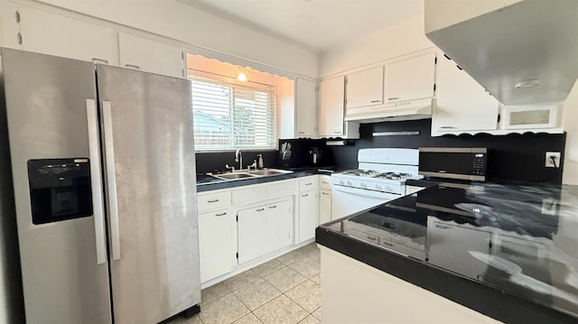 1380 Elaine Dr, Hanford, CA 93230 - kitchen with appliances with stainless steel finishes, a sink, under cabinet range hood, white cabinetry, and dark countertops