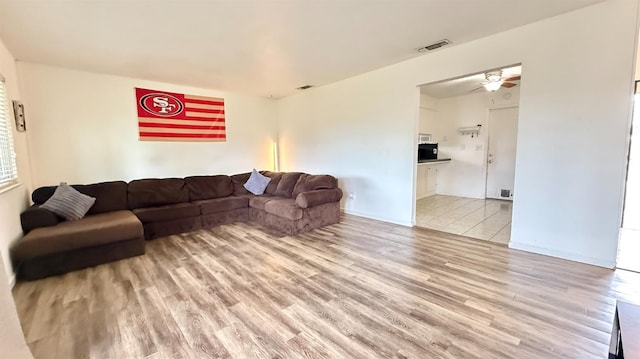 1380 Elaine Dr, Hanford, CA 93230 - living room featuring light wood finished floors and ceiling fan