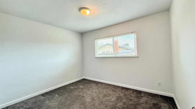1380 Elaine Dr, Hanford, CA 93230 - spare room with dark carpet and baseboards