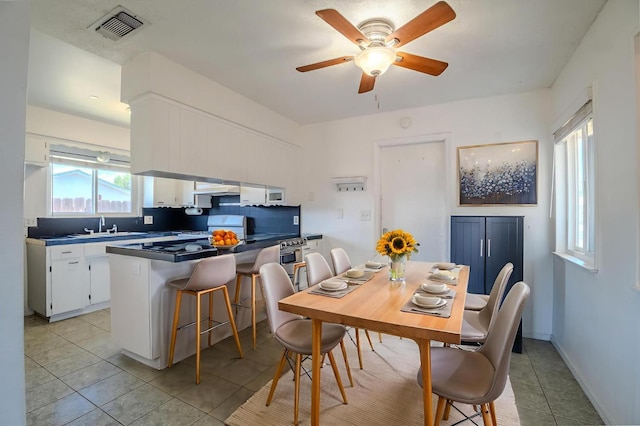 1380 Elaine Dr, Hanford, CA 93230 - dining space featuring light tile patterned floors and a ceiling fan