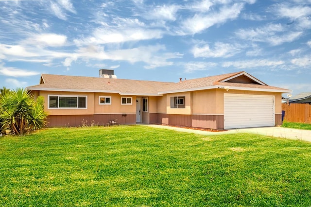 1380 Elaine Dr, Hanford, CA 93230 - ranch-style home featuring driveway, a garage, and stucco siding
