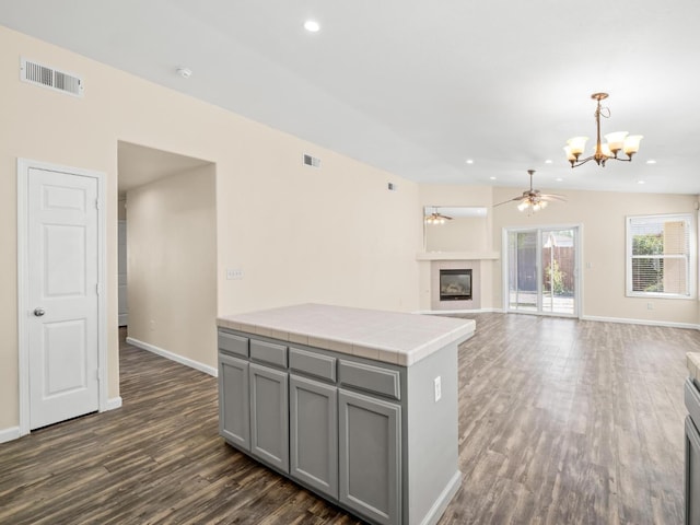 5611 W Carmen Ave, Fresno, CA 93722 - kitchen with gray cabinets, a chandelier, dark wood finished floors, ceiling fan, and baseboards