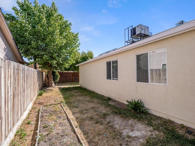 5611 W Carmen Ave, Fresno, CA 93722 - fenced backyard featuring a vegetable garden