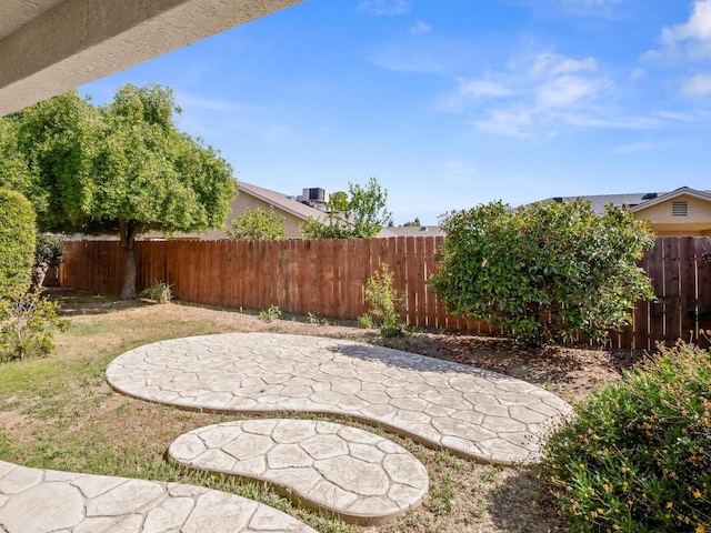 5611 W Carmen Ave, Fresno, CA 93722 - view of yard featuring a patio