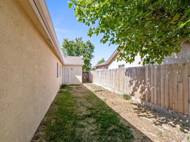 5611 W Carmen Ave, Fresno, CA 93722 - view of yard with fence