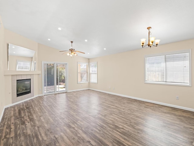 5611 W Carmen Ave, Fresno, CA 93722 - unfurnished living room featuring a chandelier, wood finished floors, baseboards, a fireplace, and a ceiling fan