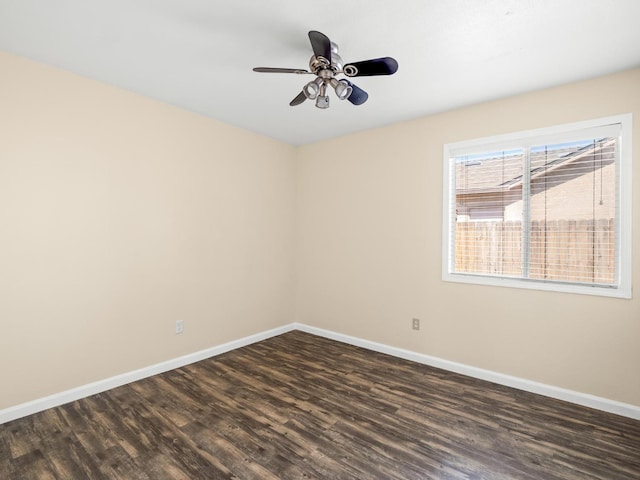 5611 W Carmen Ave, Fresno, CA 93722 - unfurnished room featuring dark wood-type flooring, baseboards, and a ceiling fan