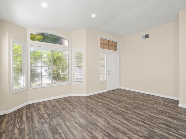 5611 W Carmen Ave, Fresno, CA 93722 - unfurnished room with dark wood finished floors, baseboards, and recessed lighting