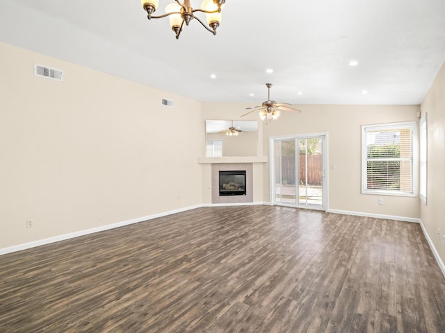 5611 W Carmen Ave, Fresno, CA 93722 - unfurnished living room featuring dark wood-style floors, baseboards, a chandelier, a fireplace, and a ceiling fan