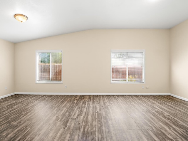 5611 W Carmen Ave, Fresno, CA 93722 - empty room featuring wood finished floors, baseboards, and lofted ceiling