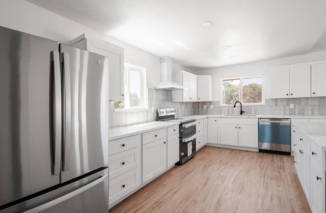 15758 Mark Rd, Madera, CA 93636 - kitchen with stainless steel appliances, wall chimney range hood, a sink, light countertops, and decorative backsplash