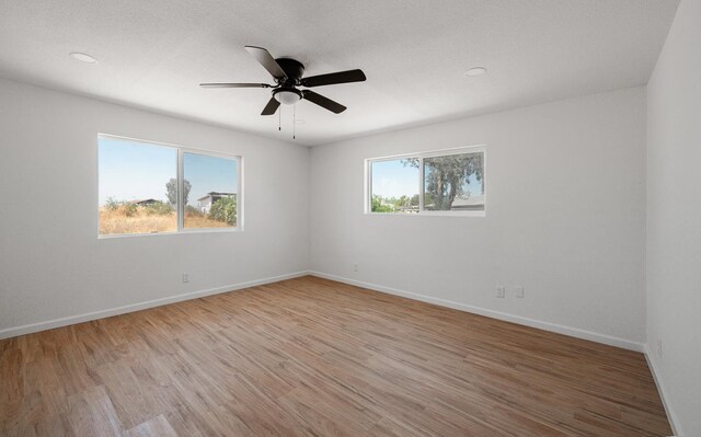 15758 Mark Rd, Madera, CA 93636 - spare room with light wood-style floors, ceiling fan, and recessed lighting