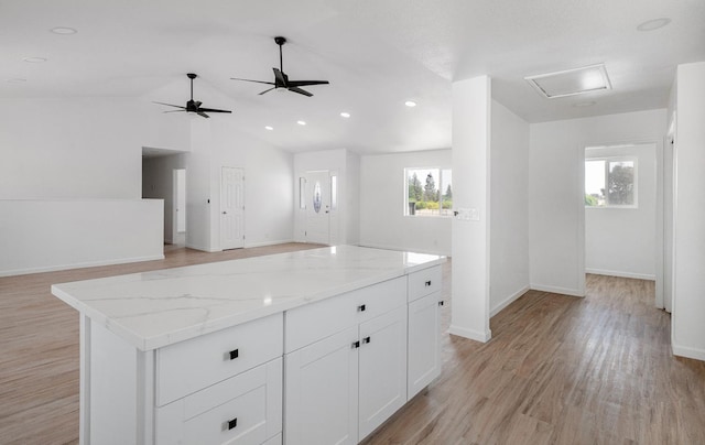 15758 Mark Rd, Madera, CA 93636 - kitchen featuring light wood-type flooring, open floor plan, white cabinetry, baseboards, and a kitchen island