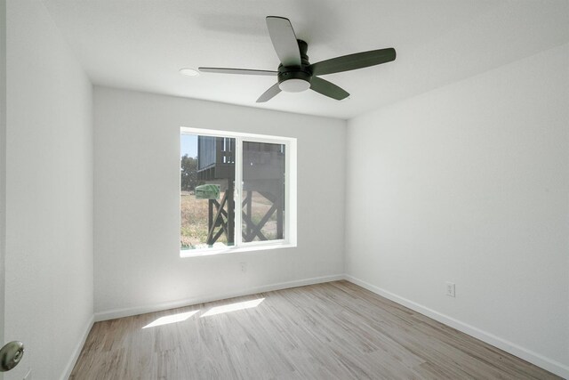 15758 Mark Rd, Madera, CA 93636 - empty room featuring wood finished floors, healthy amount of natural light, and a ceiling fan