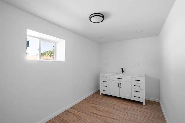 15758 Mark Rd, Madera, CA 93636 - bar with light wood-type flooring, baseboards, and a sink