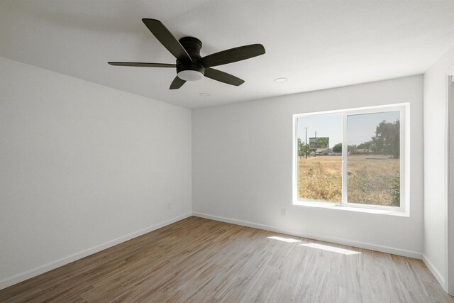 15758 Mark Rd, Madera, CA 93636 - spare room featuring light wood-style floors, a ceiling fan, and recessed lighting