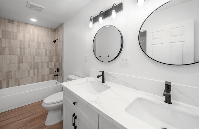 15758 Mark Rd, Madera, CA 93636 - bathroom featuring double vanity, shower / bath combination, and wood finished floors