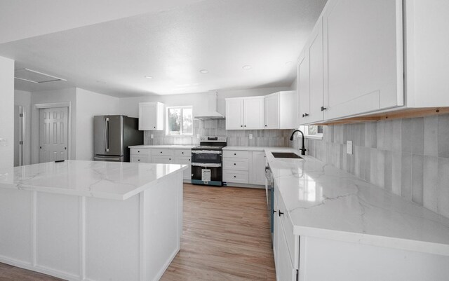 15758 Mark Rd, Madera, CA 93636 - kitchen with appliances with stainless steel finishes, custom exhaust hood, light stone countertops, decorative backsplash, and white cabinets