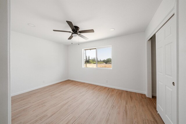 15758 Mark Rd, Madera, CA 93636 - unfurnished bedroom with light wood-style floors, a closet, ceiling fan, and recessed lighting