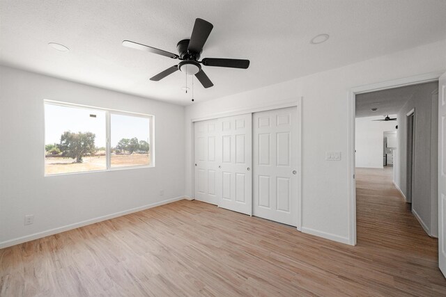 15758 Mark Rd, Madera, CA 93636 - unfurnished bedroom featuring light wood-style flooring, a closet, and ceiling fan