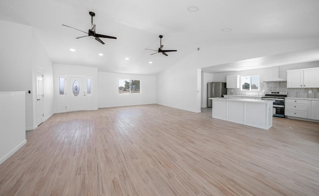 15758 Mark Rd, Madera, CA 93636 - unfurnished living room featuring a ceiling fan, lofted ceiling, recessed lighting, and light wood finished floors