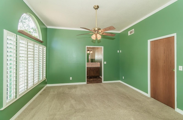 15501 Garlock Ln, Prather, CA 93651 - unfurnished bedroom with carpet, crown molding, baseboards, connected bathroom, and a textured ceiling