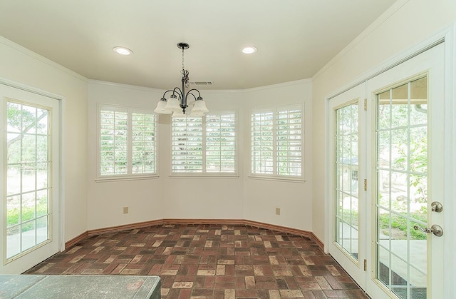 15501 Garlock Ln, Prather, CA 93651 - unfurnished dining area with baseboards, a chandelier, healthy amount of natural light, brick floors, and crown molding