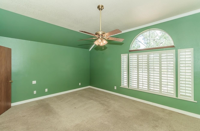 15501 Garlock Ln, Prather, CA 93651 - carpeted empty room with ceiling fan, baseboards, vaulted ceiling, and ornamental molding
