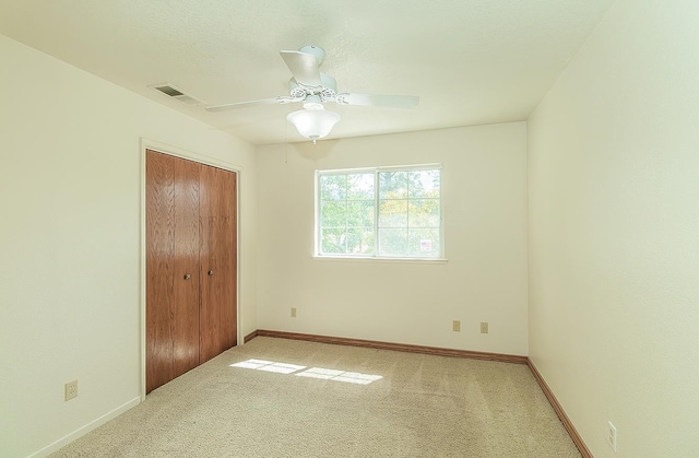 15501 Garlock Ln, Prather, CA 93651 - unfurnished bedroom with carpet floors, baseboards, a closet, and a ceiling fan