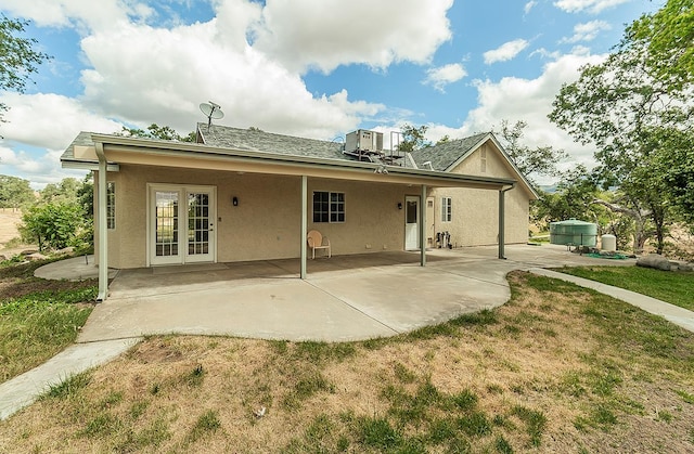 15501 Garlock Ln, Prather, CA 93651 - rear view of house featuring a patio area, stucco siding, french doors, a lawn, and central AC