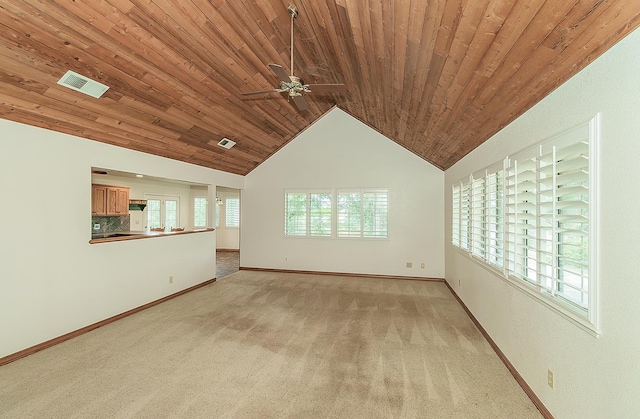 15501 Garlock Ln, Prather, CA 93651 - unfurnished living room featuring light carpet, baseboards, lofted ceiling, ceiling fan, and wooden ceiling