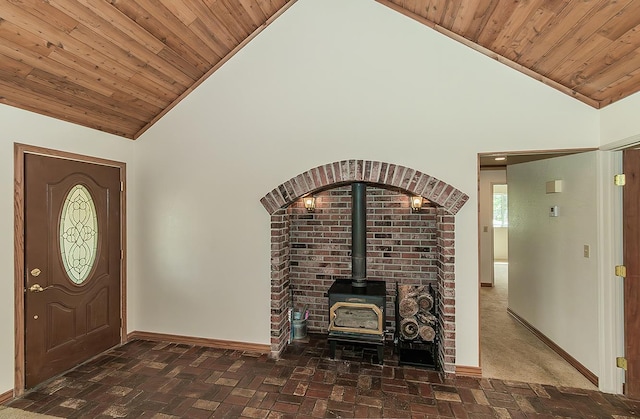 15501 Garlock Ln, Prather, CA 93651 - entryway featuring a wood stove, baseboards, wood ceiling, brick flooring, and high vaulted ceiling