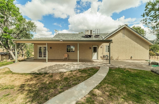 15501 Garlock Ln, Prather, CA 93651 - back of house featuring french doors, stucco siding, a patio area, and a yard