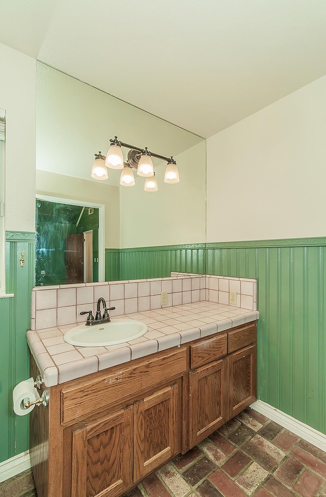 15501 Garlock Ln, Prather, CA 93651 - bathroom with a sink, brick patterned flooring, and wainscoting