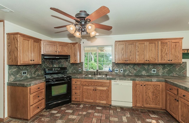 15501 Garlock Ln, Prather, CA 93651 - kitchen with black gas range oven, white dishwasher, a sink, under cabinet range hood, and dark countertops