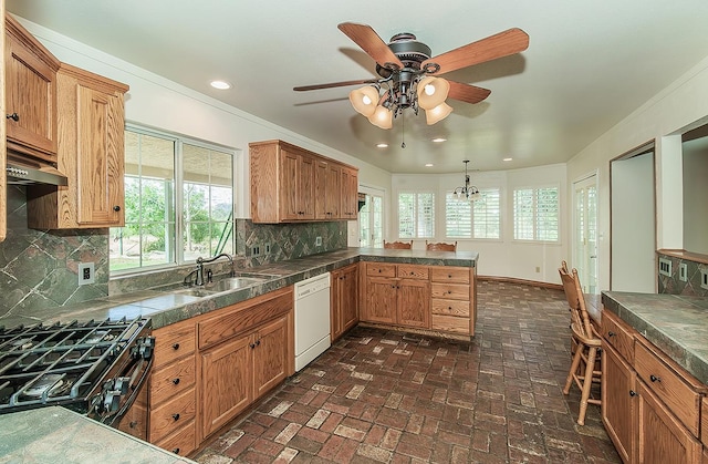 15501 Garlock Ln, Prather, CA 93651 - kitchen with dishwasher, a sink, black gas stove, brick floors, and plenty of natural light