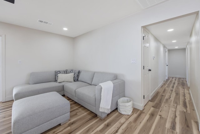 336 W Locust Ave, Pinedale, CA 93650 - living room featuring light wood-type flooring, recessed lighting, and baseboards