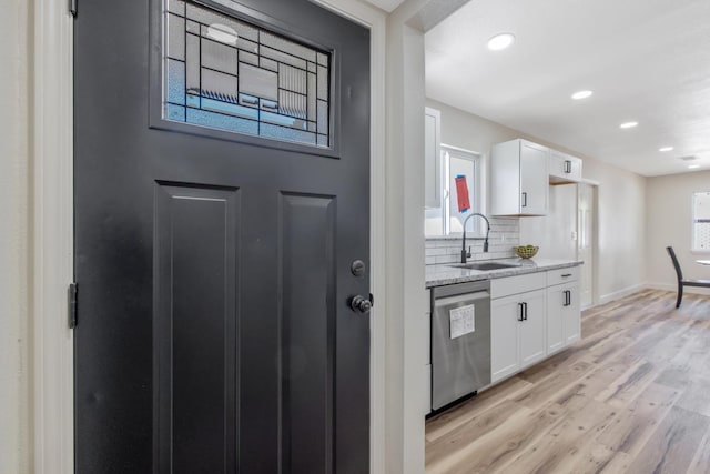 336 W Locust Ave, Pinedale, CA 93650 - kitchen with dishwasher, a sink, white cabinets, light wood-style floors, and recessed lighting