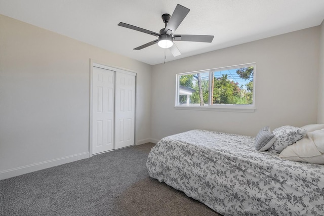 336 W Locust Ave, Pinedale, CA 93650 - bedroom with dark colored carpet, a closet, baseboards, and ceiling fan
